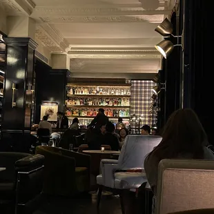 people sitting at tables in a restaurant