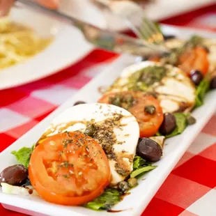 a plate of tomatoes and mozzarella