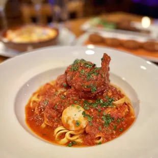 Tagliatelle all&apos; Aragosta Homemade tagliatelle pasta, Maine Lobster tail, shrimp, scallops in fresh tomato sauce