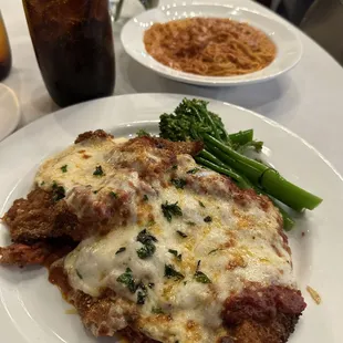 Veal Parm, Top plate is side pasta of Angel Hair and Palomino sauce.