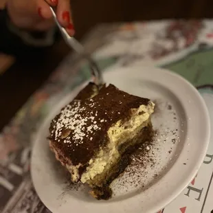 a piece of cake on a plate with a fork