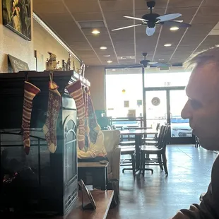 a man sitting at a table in a coffee shop