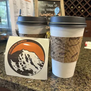 two cups of coffee on a counter