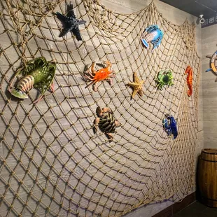 a rope net with sea creatures on it