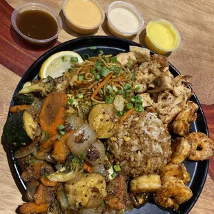 "Create your own" chicken, shrimp, yakisoba, grilled rice and grilled veggies. Sweet garlic, hot magma, fuji yumma, garlic butter.