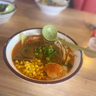 a bowl of ramen and vegetables