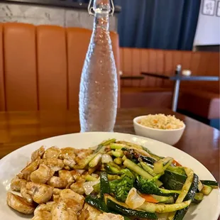 a plate of chicken and vegetables