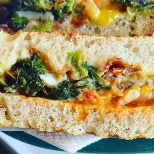 Breakfast panini with bacon, egg, cheese, spinach and added sun dried tomato mayo