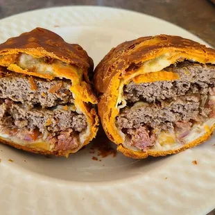 Inside the weekend special "chimichanga empanada". A burger and chorizo deep fried. Comes with lots of toppings!