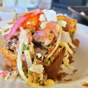 chimichanga empanada with all the toppings. Absolutely amazing, one of the best things I've eaten anywhere! The fresno hot sauce is special.