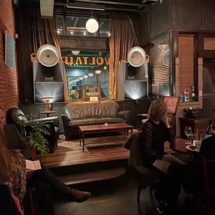 a group of people sitting around a table