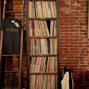 a ladder leaning against a brick wall