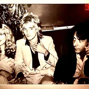 Artwork adorning walls on walk to restrooms.