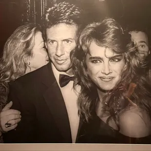 Artwork along walls to restrooms.