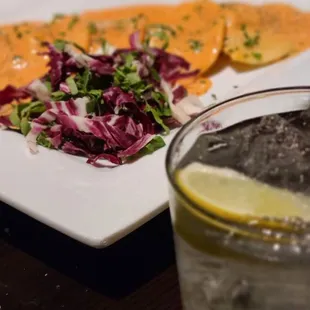 a plate of food and a glass of water