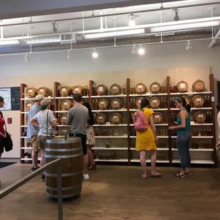 a group of people in a wine shop