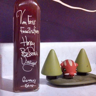 Filled a former grocery store vinegar bottle with honey basalmic. Decorative salt&amp;pepper shakers not included.