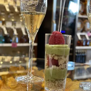 two glasses of wine and a dessert