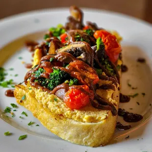 a piece of bread with mushrooms, tomatoes, and broccoli