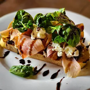 a white plate with a sandwich on it