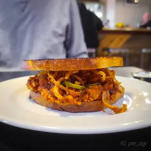 a sandwich on a white plate