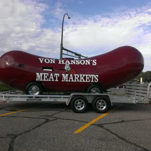 a large hot dog on a trailer