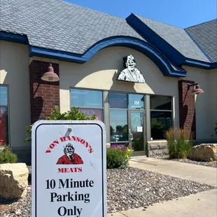 a sign in front of a restaurant