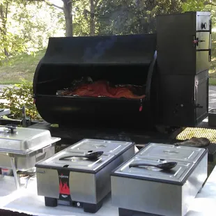 an outdoor grill with food on it