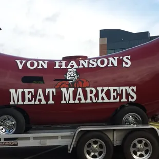 a large hot dog on a trailer