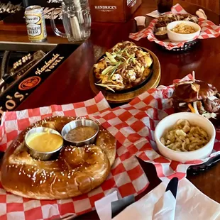 Schnitzel sandwich, beer brat, loaded potatoes, pretzel.
