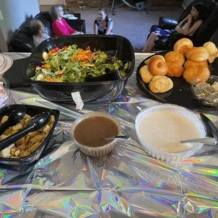 garden salad with balsamic and ranch dressing and dinner rolls.