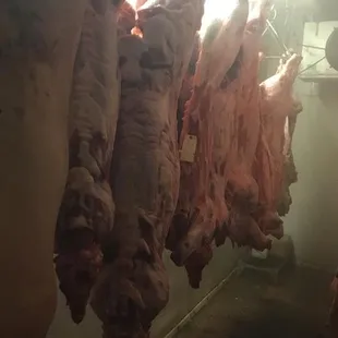 the meat hanging from the ceiling