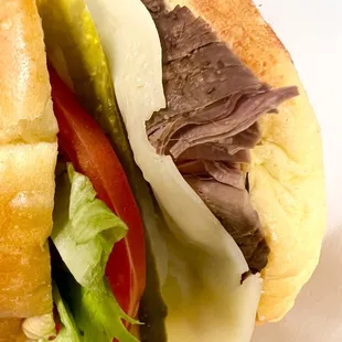 Sliced tenderloin sandwich w/baked beans, pasta and a fountain drink $10.95. Delicious!