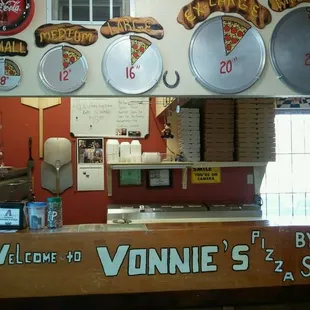 a counter with pizzas on it