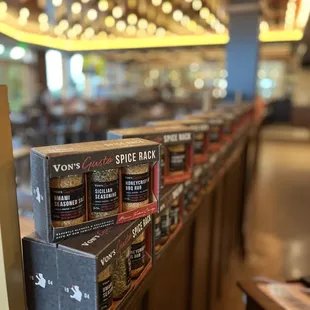 Our proprietary spices for sale on display in the restaurant