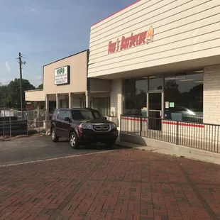 a car parked in front of a restaurant