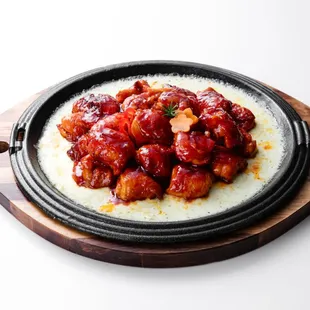 Cheese Buldak (Spicy boneless chicken topped
w/melted cheese &amp; rice cake)
