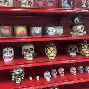 a shelf full of skulls