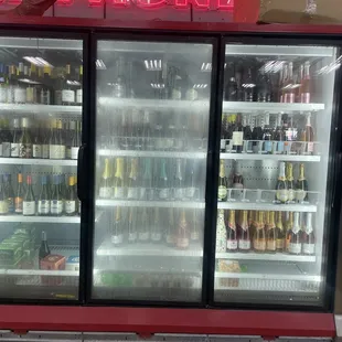 a display of beer in a cooler