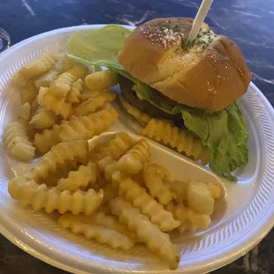 Dressed cheeseburger and fries