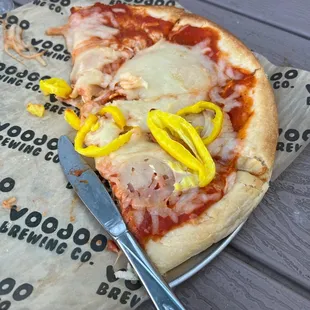 a half eaten pizza on a plate