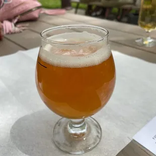 a glass of beer on a table