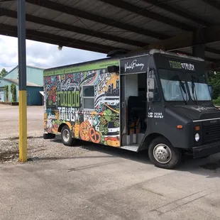 a food truck parked in a parking lot