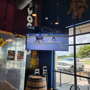 Large tv playing hockey