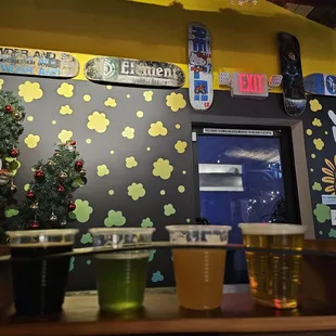 a row of beer glasses on a table