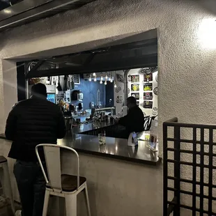 Service window from the outdoor space to the bartender so you don&apos;t have to go back inside!