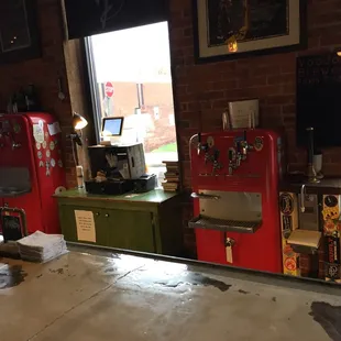 a row of soda machines