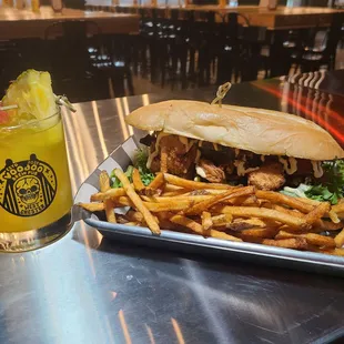 Bayou Po&apos; Boy- fried chicken and shrimp served on a fresh roll with field greens house made charred tomato compote and house made bang bang