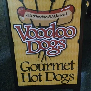 a sign for voodoo dogs gourmet hot dogs