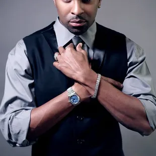 a man in a vest and tie